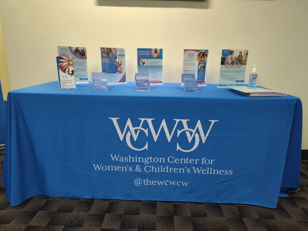 WCWCW events booth with brochures and materials